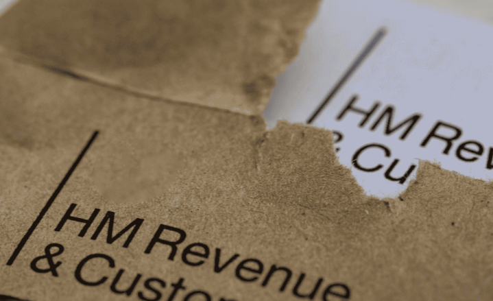 Self-assessent tax returns. Image depicts a brown envelope from HMRC containing tax documents. 