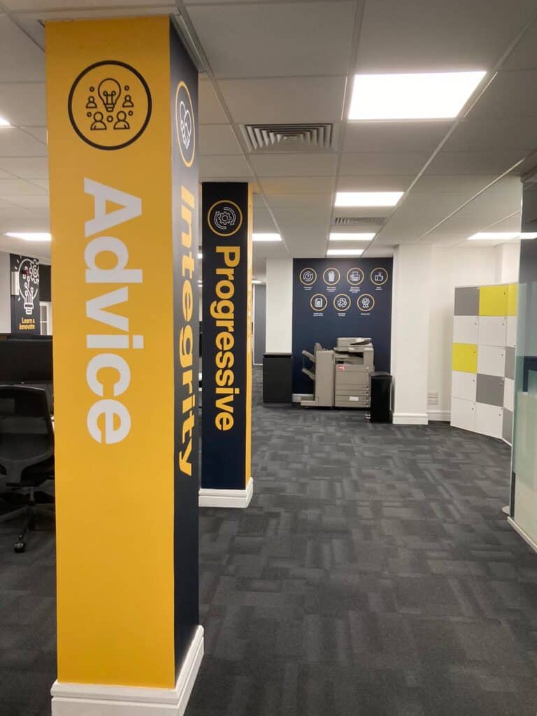 The Consilium brand story - image depicts the pillars in the Consilium Glasgow office wrapped in the four values of the company- advice, integrity, teamwork and progresive. 