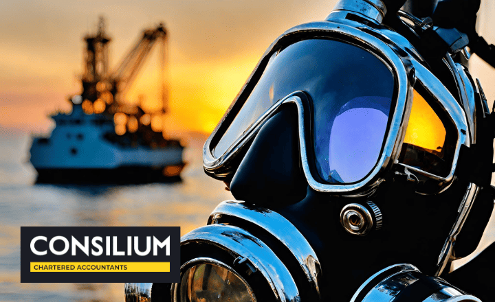 Caldive Limited - the image depicts a deep sea diving mask on the deck of a boat. it is sunset and in the background is a martime services ship on calm seas.