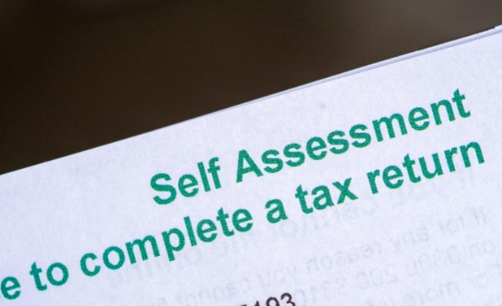 Self-assessment tax returns. Image depicts a letter from HMRC confirming the need to complete a self-assessment tax return.